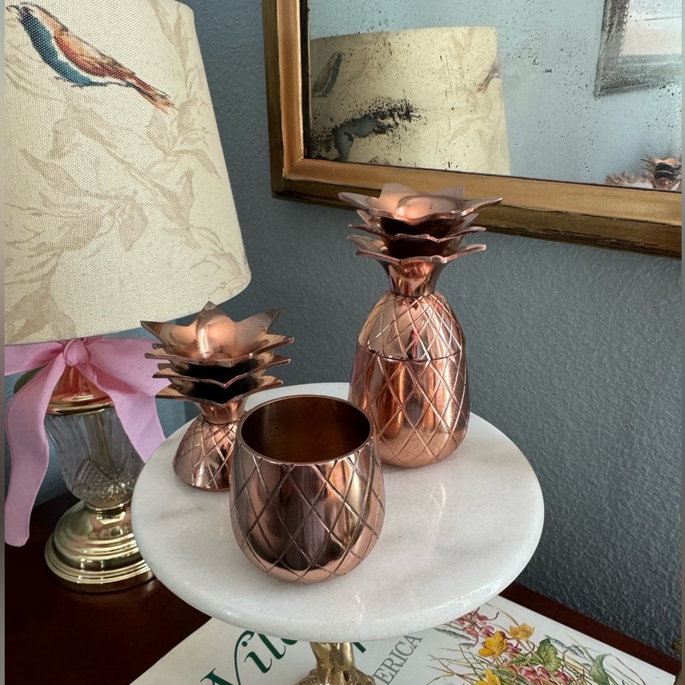 Two brass pineapple shot glasses